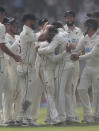 New Zealand's Ajaz Patel , center, celebrates the dismissal of India's Mohammed Siraj with his team players during the day two of their second test cricket match with India in Mumbai, India, Saturday, Dec. 4, 2021.(AP Photo/Rafiq Maqbool)