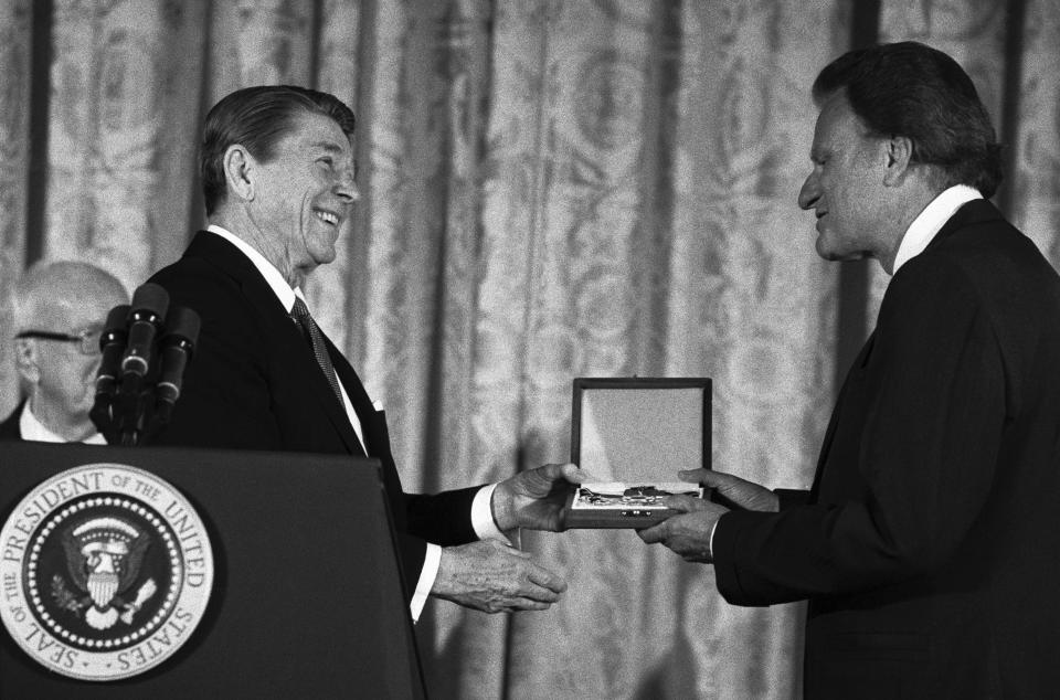 President Ronald Reagan presents the Presidential Medal of Freedom to Graham at the White House.