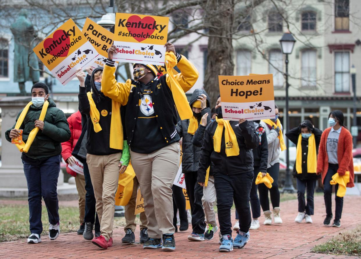 Students from Holy Family School in Covington, Kentucky make their way to a pro school choice rally at the Old State Capitol building in Frankfort. Jan. 24, 2022
