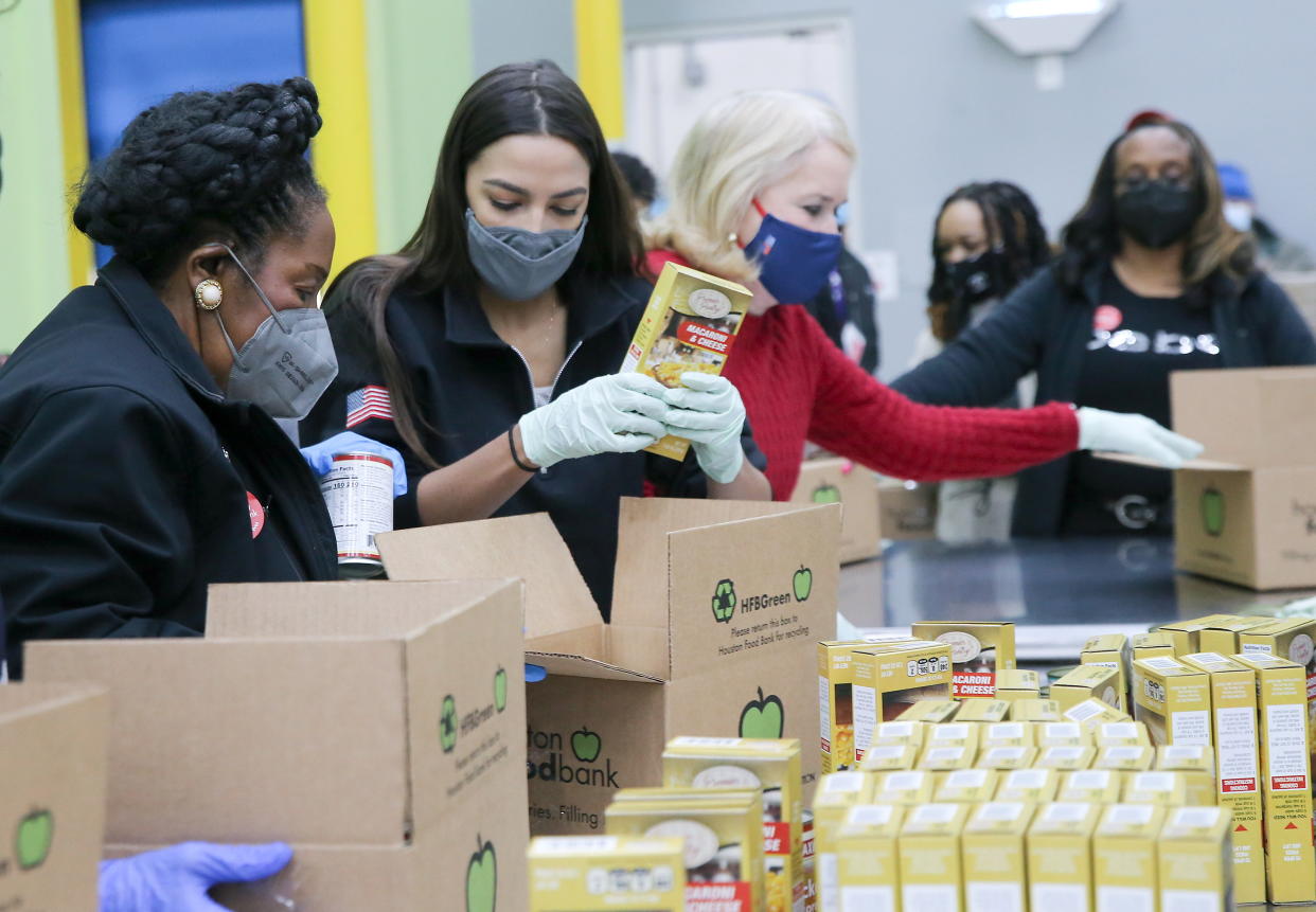 U.S. Rep. Sheila Jackson Lee (D-Texas), Rep. Alexandria Ocasio-Cortez (D-N.Y.) and Rep. Sylvia Garcia (D-Texas) load boxes at their work station at the Houston Food Bank in Houston, Texas, on Feb. 20, 2021. (Photo: Elizabeth Conley/Houston Chronicle/Pool/Reuters)