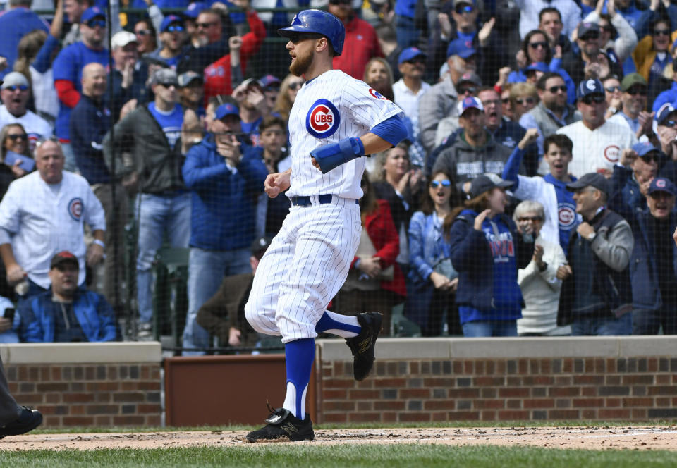 Chicago Cubs' Ben Zobrist (18) scores during the first inning of a baseball game against the St. Louis Cardinals on Saturday, Sept. 29, 2018, in Chicago. (AP Photo/Matt Marton)