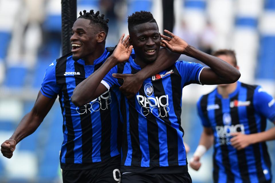 Atalanta's Gambian forward Musa Barrow (C) celebrate with Atalanta's Colombian forward Duvan Zapata after opening the scoring during the Italian Serie A football match Atalanta Bergama vs Genoa on May 11, 2019 at the Mapei Stadium - Citta del Tricolore in Reggio Emilia. (Photo by Miguel MEDINA / AFP)        (Photo credit should read MIGUEL MEDINA/AFP/Getty Images)