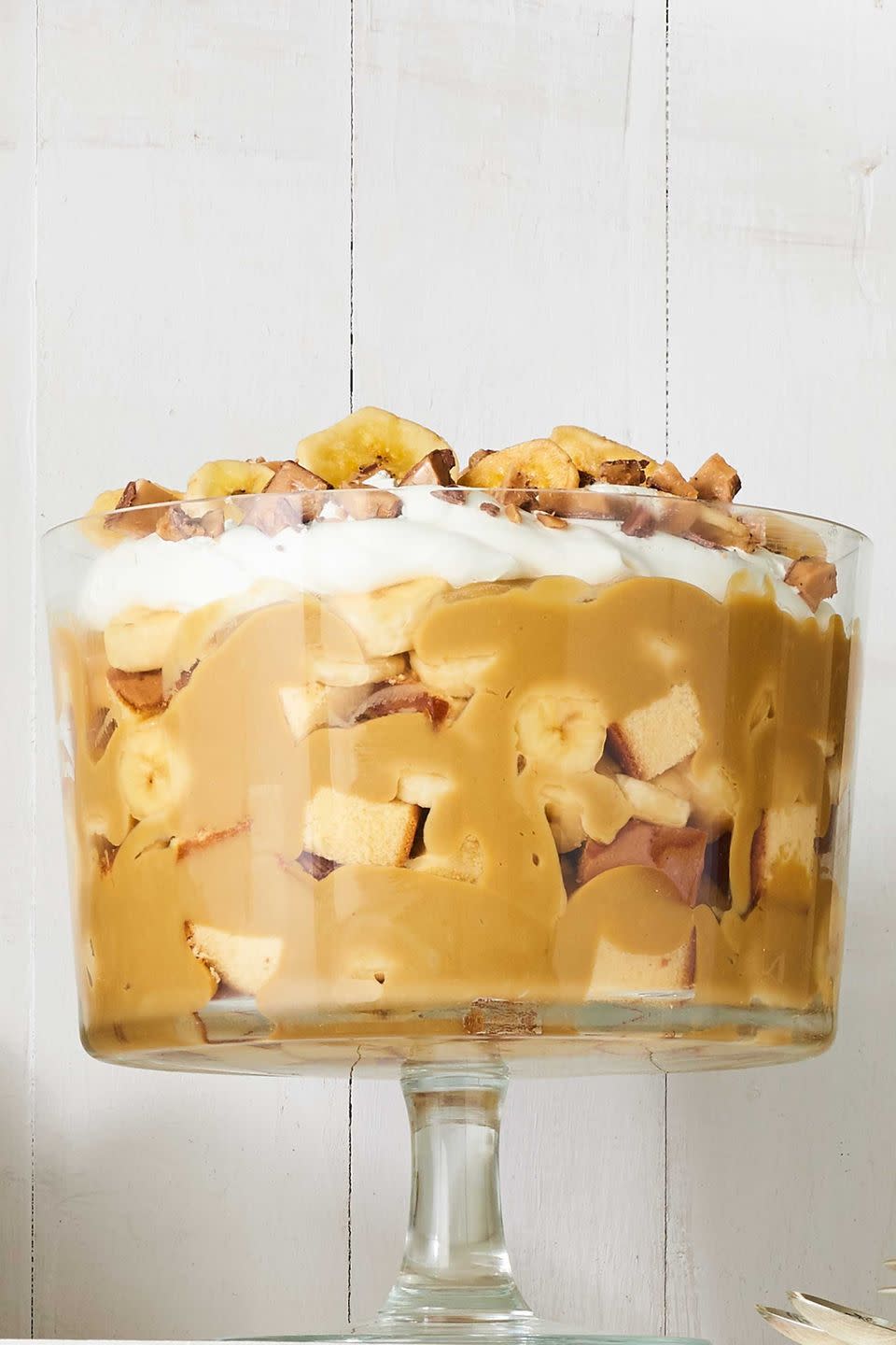 <p>If you've got a busy holiday schedule, a trifle is a great option! This recipe combines the flavors of banana and butterscotch for an easy and no-bake dessert that everyone's sure to love. </p><p><strong><a href="https://www.countryliving.com/food-drinks/recipes/a40033/butterscotch-banana-trifle-recipe/" rel="nofollow noopener" target="_blank" data-ylk="slk:Get the recipe for Butterscotch-Banana Trifle;elm:context_link;itc:0;sec:content-canvas" class="link ">Get the recipe for Butterscotch-Banana Trifle</a>.</strong></p>