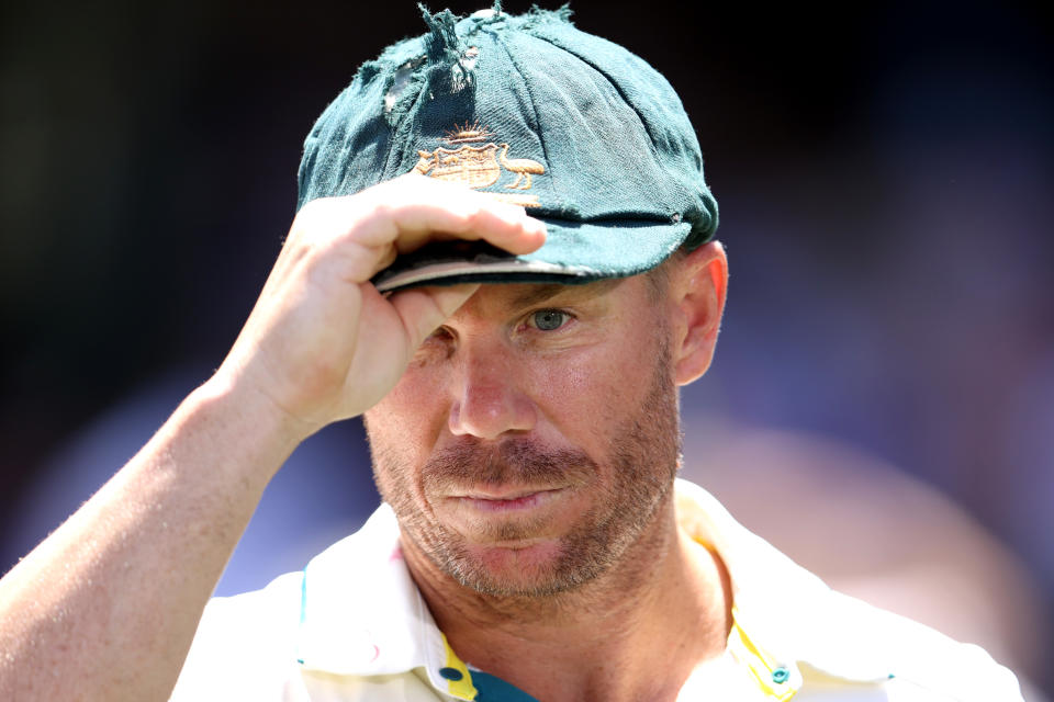 David Warner reacts with his baggy green.