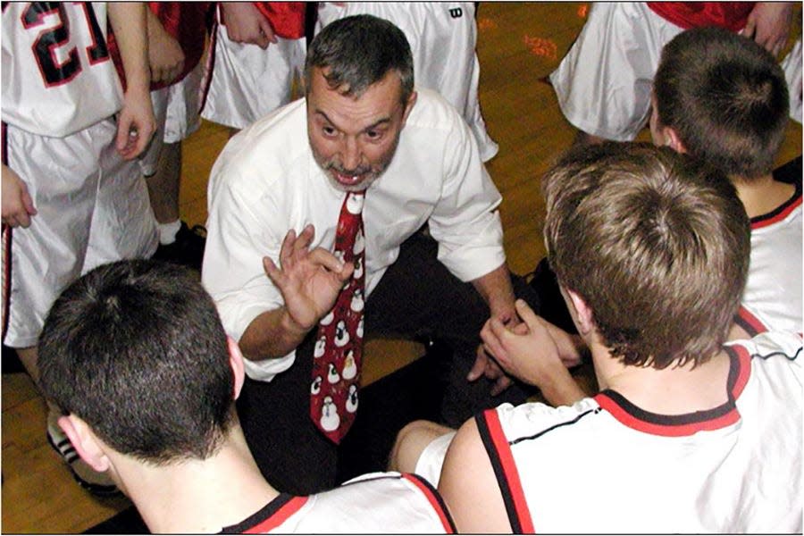 Honesdale coaching legend Ron Rowe in the huddle during his 30-year tenure as boys varsity coach. Rowe amassed more than 300 wins as Hornet skipper.