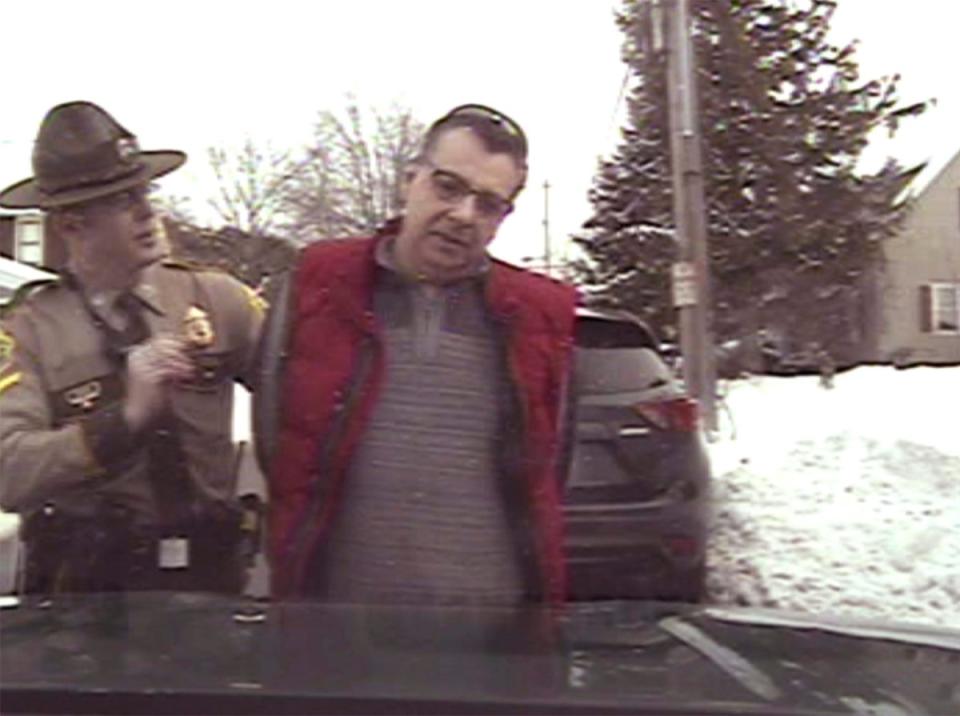 Gregory Bombard settled a lawsuit with the Vermont State Police after he was arrested for disorderly conduct for flipping off a state trooper (American Civil Liberties Union/Vt. State Police via AP)