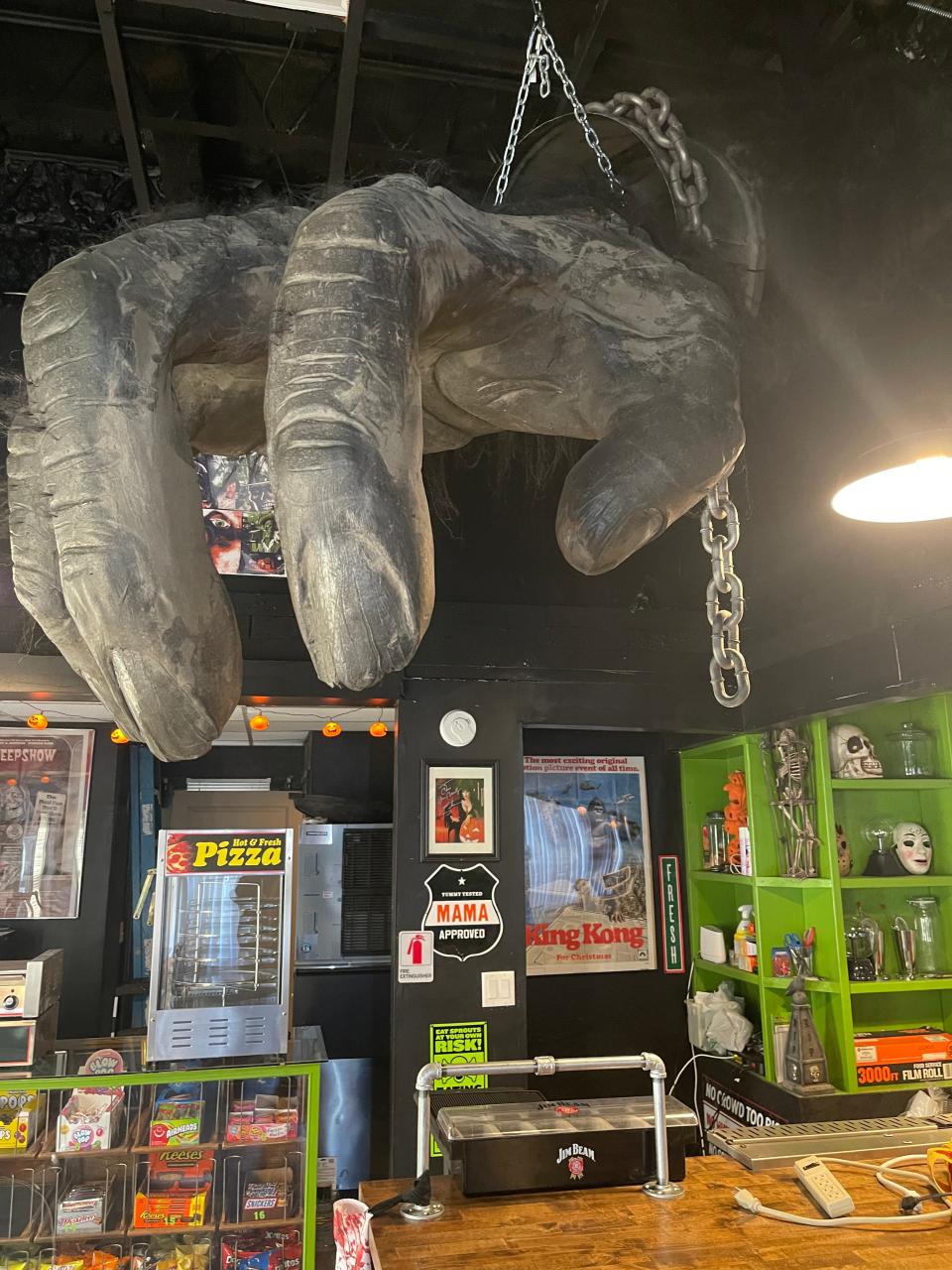 An eight-foot King Kong hand hangs overhead in Monsterama Arcade, 3104 S.W. Ninth St. Suite 1, Des Moines.