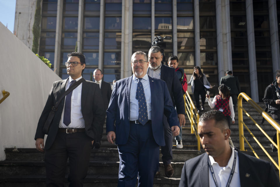 FILE - Guatemalan President-elect Bernardo Arévalo leaves a court after a judge denied his request for access to the file of investigation against his party, Semilla, in Guatemala City, Dec. 12, 2023. Arévalo is a 65-year-old academic and diplomat who had worked for years in international conflict resolution before launching a political career. (AP Photo/Moises Castillo)