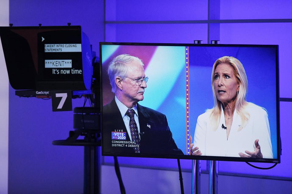 Incumbent U.S. Rep. John Rutherford, Republican, and Democratic challenger Donna Deegan are shown on a monitor during the debate at WJXT-TV's studios in Jacksonville.