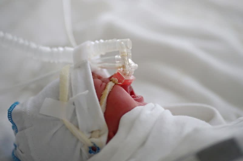 FILE PHOTO: A newborn baby infected with COVID-19 receives oxygen at a maternity hospital in Volgograd