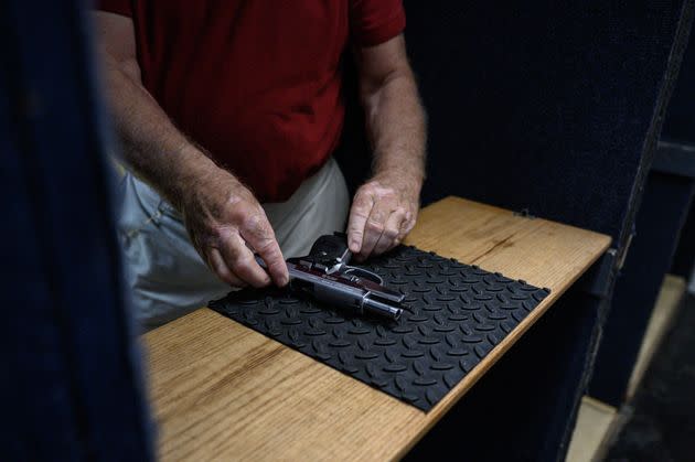 Shooting range owner John Deloca prepares his pistol at his range in Queens, New York, on June 23. (Photo: ED JONES via Getty Images)