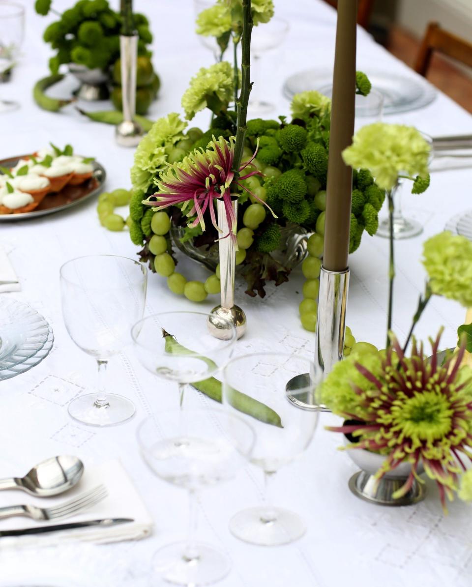 Vintage silver serveware and candlesticks on Jackson's indoor table