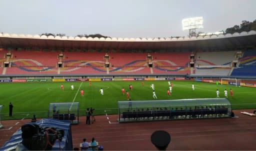 South and North Korea compete before empty stands in a Pyongyang stadium