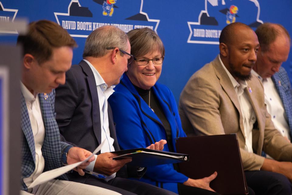 Kansas chancellor Douglas Girold, second from left, chats with Gov. Laura Kelly, third from left, before the start of Tuesday's Gateway District unveil.