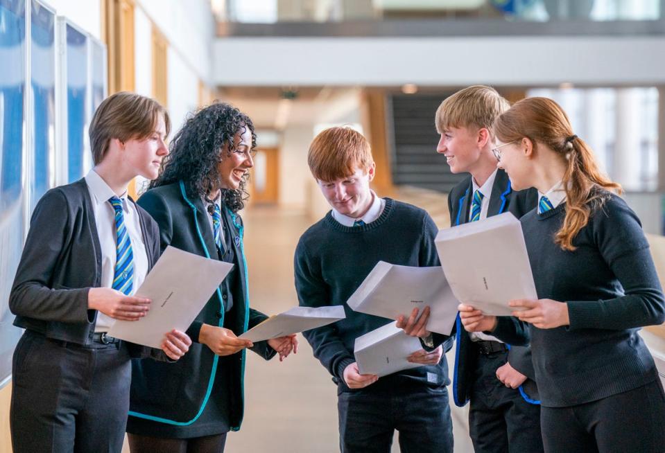 9 August 2022: Students (from left) Sophie Thwaites, Aaliyah McLaine, Michael Stewart, Aaron Boyack and Claire McNab at Auchmuty High School in Glenrothes, Fife, check their results as high school pupils across Scotland find out their exam results (PA)