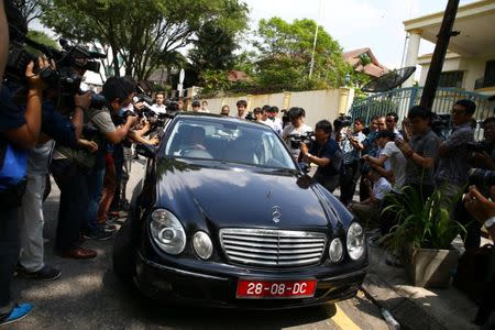 Members of the media surround a North Korea official's car as it leaves the North Korea embassy, following the murder of Kim Jong Nam, in Kuala Lumpur, Malaysia, February 23, 2017. REUTERS/Athit Perawongmetha