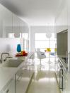 <p>In this sleek, blue-accented <a rel="nofollow noopener" href="https://www.elledecor.com/design-decorate/house-interiors/a8970/minimalist-decor/" target="_blank" data-ylk="slk:NYC kitchen;elm:context_link;itc:0;sec:content-canvas" class="link ">NYC kitchen</a>, the cabinetry is by <a rel="nofollow noopener" href="https://bulthaup.com/en-us/" target="_blank" data-ylk="slk:Bulthaup;elm:context_link;itc:0;sec:content-canvas" class="link ">Bulthaup</a>, the countertop and sink are <a rel="nofollow noopener" href="http://www.corian.com/" target="_blank" data-ylk="slk:Corian;elm:context_link;itc:0;sec:content-canvas" class="link ">Corian</a>, the fittings are by Vola, and the oven and cooktop are by <a rel="nofollow noopener" href="http://www.gaggenau.com/us/" target="_blank" data-ylk="slk:Gaggenau;elm:context_link;itc:0;sec:content-canvas" class="link ">Gaggenau</a>; the light fixture is by <a rel="nofollow noopener" href="https://www.bega-us.com/" target="_blank" data-ylk="slk:Bega;elm:context_link;itc:0;sec:content-canvas" class="link ">Bega</a>, and the floor is terrazzo.</p>