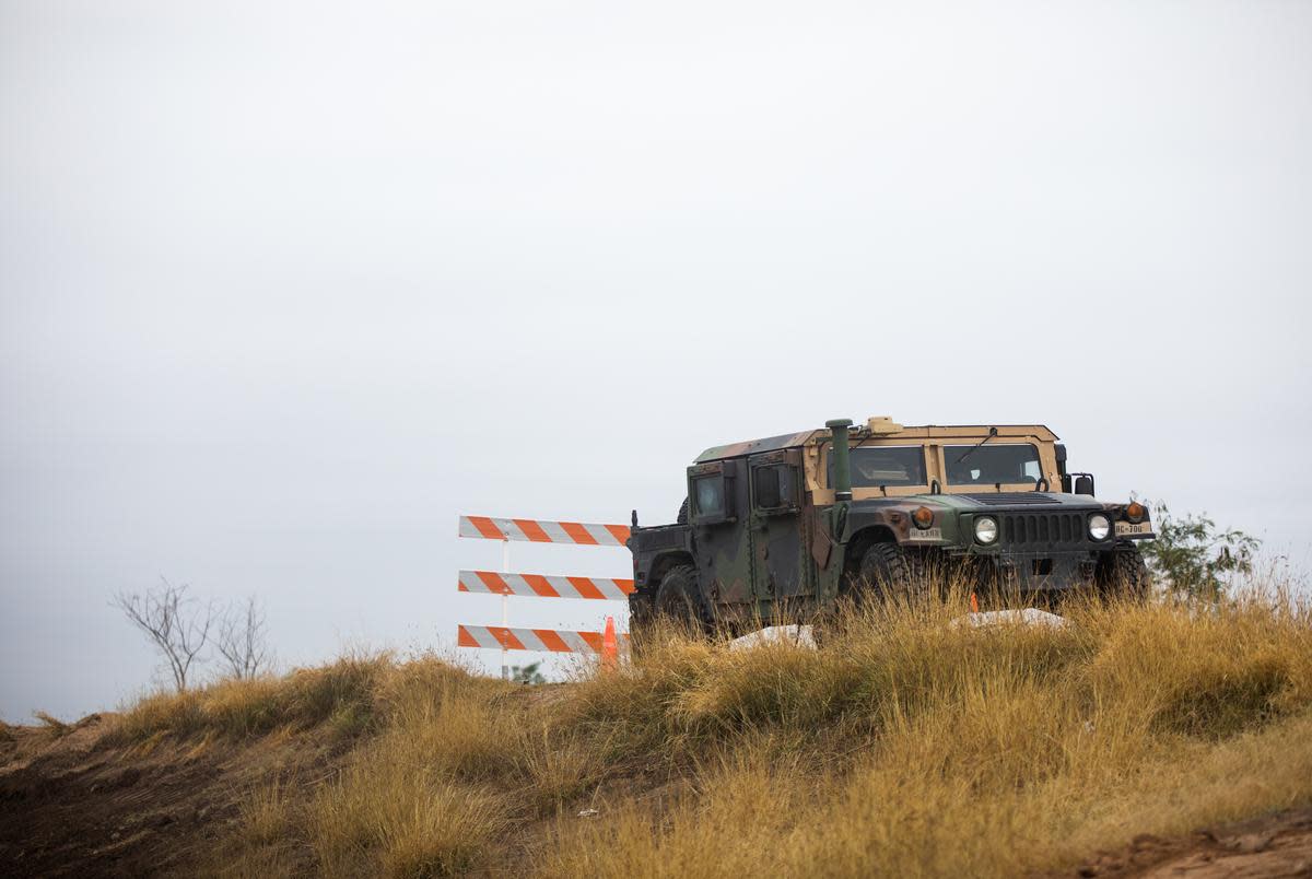 A National Guard Humvee near a construction site for what the federal government says is a levee improvement project near Bentsen-Rio Grande Valley State Park in Mission on Jan. 12, 2022.