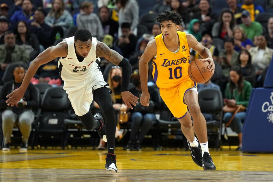 Los Angeles Lakers guard Max Christie (10) dribbles against Miami Heat forward Jamal Cain (54) during the fourth quarter at the California Summer League at Chase Center.
