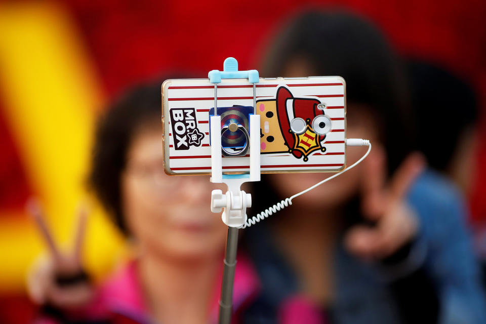 <p>People take pictures of themselves in Tiananmen Square as they celebrate National Day marking the 67th anniversary of the founding of the People’s Republic of China, in Beijing October 1, 2016. (REUTERS/Damir Sagolj) </p>