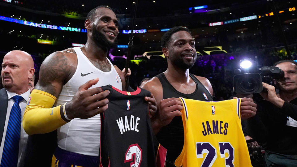 James and Wade pose with each other’s jerseys. Pic: Getty