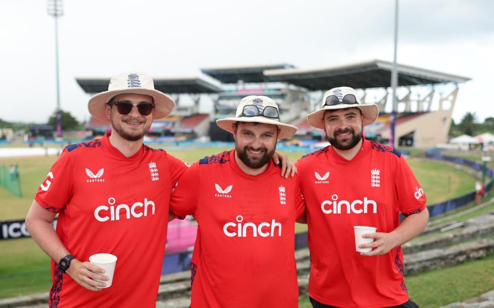 Three England supporters in attendance at the Sir Vivian Richards Stadium.