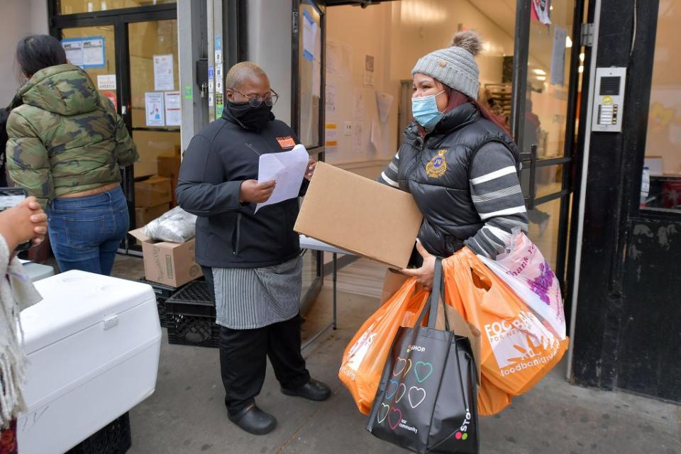 <p>People receive parcels at the Food Bank Community Kitchen in New York on Thanksgiving Eve</p>Getty Images for Food Bank For N