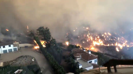 An aerial view showing the Woolsey Fire in Malibu, California, U.S. is seen in this still image obtained via from a November November 9, 2018 social media video. Michael Dubron/TWITTER