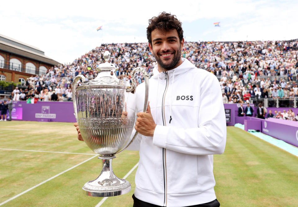 Pictured here, Matteo Berrettini posing with the trophy after winning against Filip Krajinovic in the Queen's Club final. 