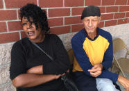 Benetta White and David Lloyd sit after escaping their flooded yard to escape Hurricane Florence's latest life-threatening punch in Bladenboro, N.C., Friday, Sept. 21, 2018. This was their second evacuation in a week. They were among 100 people rescued with helicopters, boats and high-wheeled military vehicles during a six-hour rescue operation in southeastern North Carolina's Bladen County that lasted into Friday morning. (AP Photo/Alan Suderman)