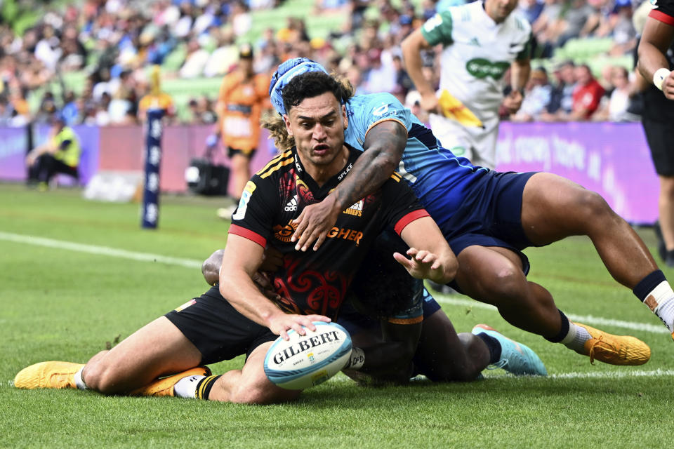 Shaun Stevenson of the Hamilton, New Zealand-based Chiefs scores a try against Moana Pasifika in their Super Rugby Pacific match in Melbourne, Saturday, March 4, 2023. (Joel Carrett/AAP Image via AP)