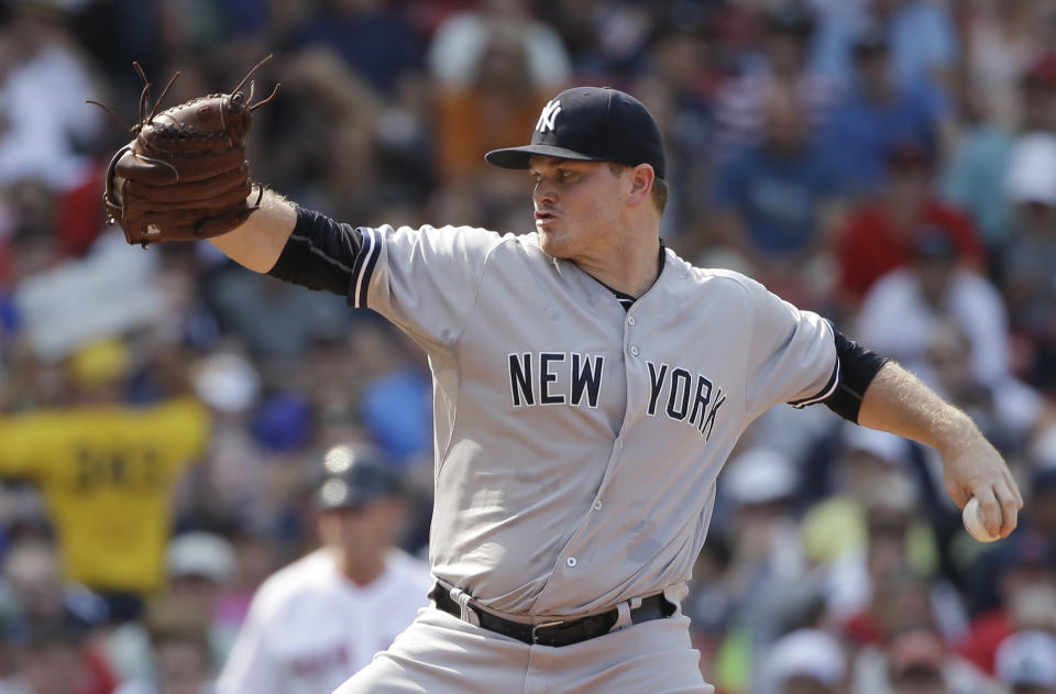 FILE - In this July 12, 2015, file photo, New York Yankees relief pitcher Justin Wilson delivers against the Boston Red Sox in the seventh inning of a baseball game at Fenway Park in Boston. Left-hander Wilson returned to the Yankees after two seasons with the Mets in Queens, agreeing Monday, Feb. 15, 2021, to a one-year contract that includes player and club options for 2022, a person familiar with the agreement told The Associated Press. The person spoke on condition of anonymity because the deal was subject to a successful physical. (AP Photo/Steven Senne, File)