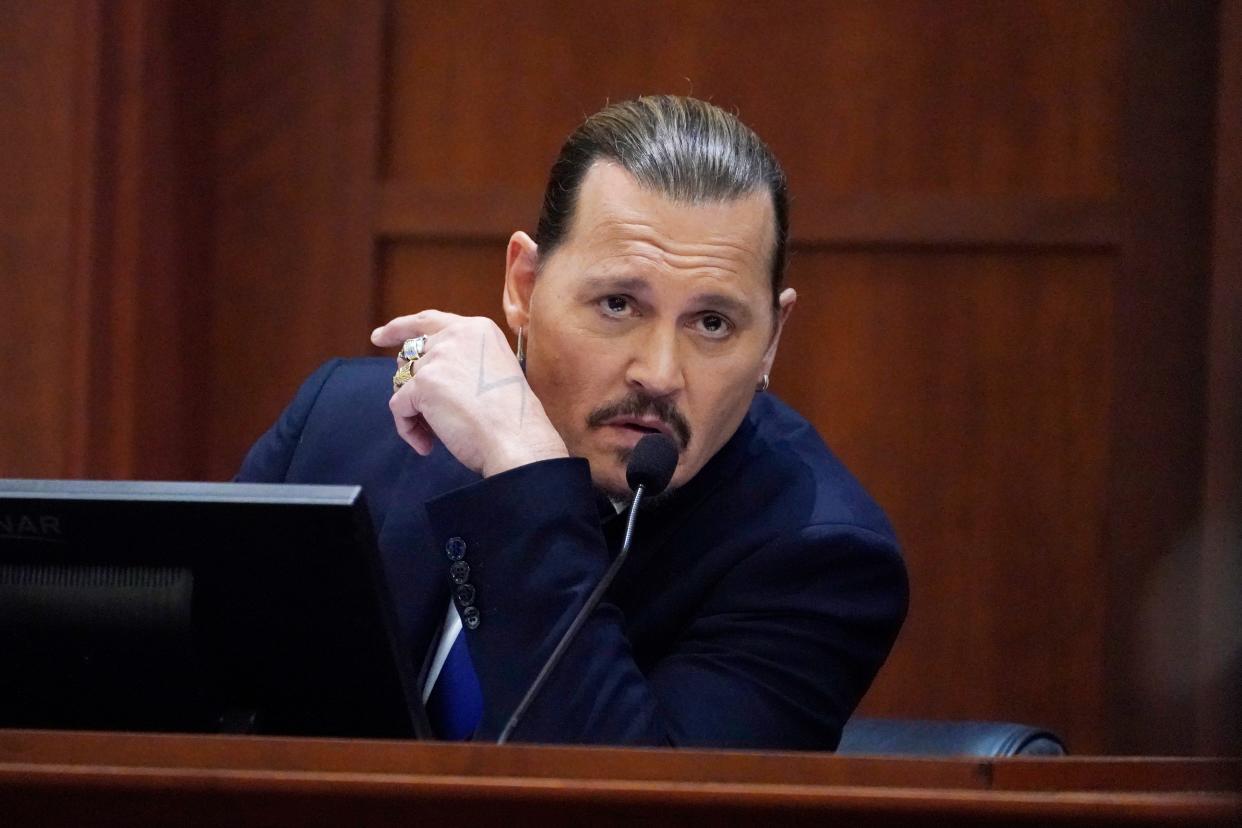 Actor Johnny Depp testifies in the courtroom at the Fairfax County Circuit Courthouse in Fairfax, Va., on April 25, 2022.