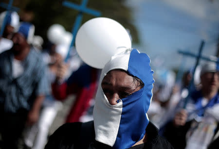 A Nicaraguan expat living in Costa Rica takes part in the "Caravan for Liberty and Justice" to protest against the government of Nicaraguan President Daniel Ortega, in La Cruz, Costa Rica border with Nicaragua, December 16, 2018. REUTERS/Juan Carlos Ulate