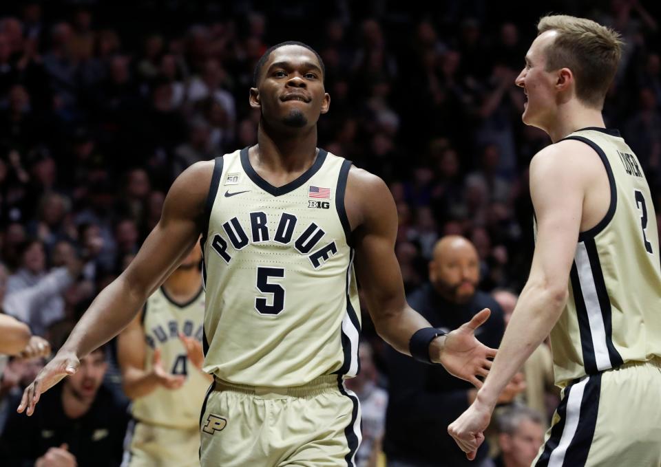 Purdue Boilermakers guard Brandon Newman (5) and Purdue Boilermakers guard Fletcher Loyer (2) celebrate during the NCAA men’s basketball game against the Illinois Fighting Illini, Sunday, March 5, 2023, at Mackey Arena in West Lafayette, Ind. The Purdue Boilermakers won 76-71.