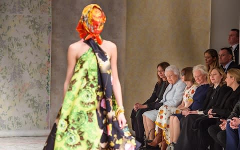 The Queen watches a model wearing a Richard Quinn headscarf - Credit: Matt Crossick