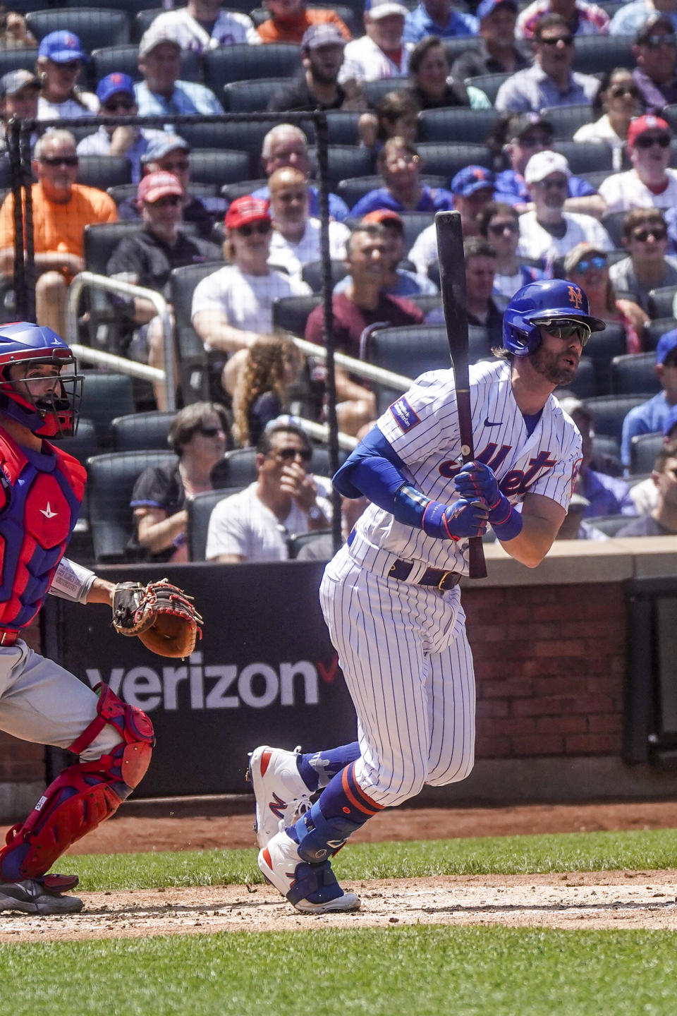 New York Mets batter Jeff McNeil watch his ground out to third during the first inning of a baseball game against the Philadelphia Phillies, Thursday, June 1, 2023, in New York. (AP Photo/Bebeto Matthews)