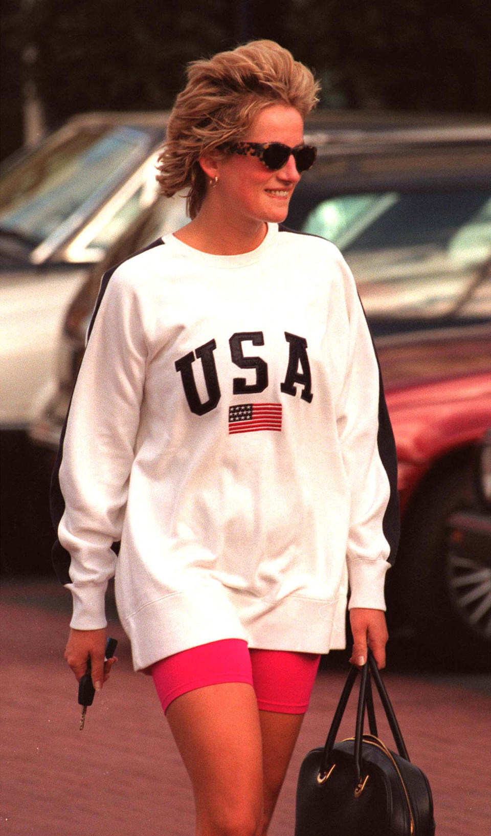 The late Princess of Wales wore the 'USA' sweatshirt at Chelsea Harbour Club in 1997. (Getty Images)