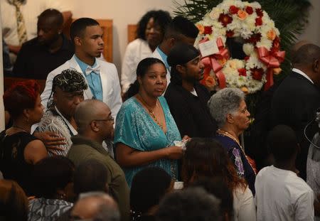 Esaw Garner (C) is shown during the funeral for her husband Eric Garner at Bethel Baptist Church in Brooklyn, New York July 23, 2014. REUTERS/Julia Xanthos/Pool