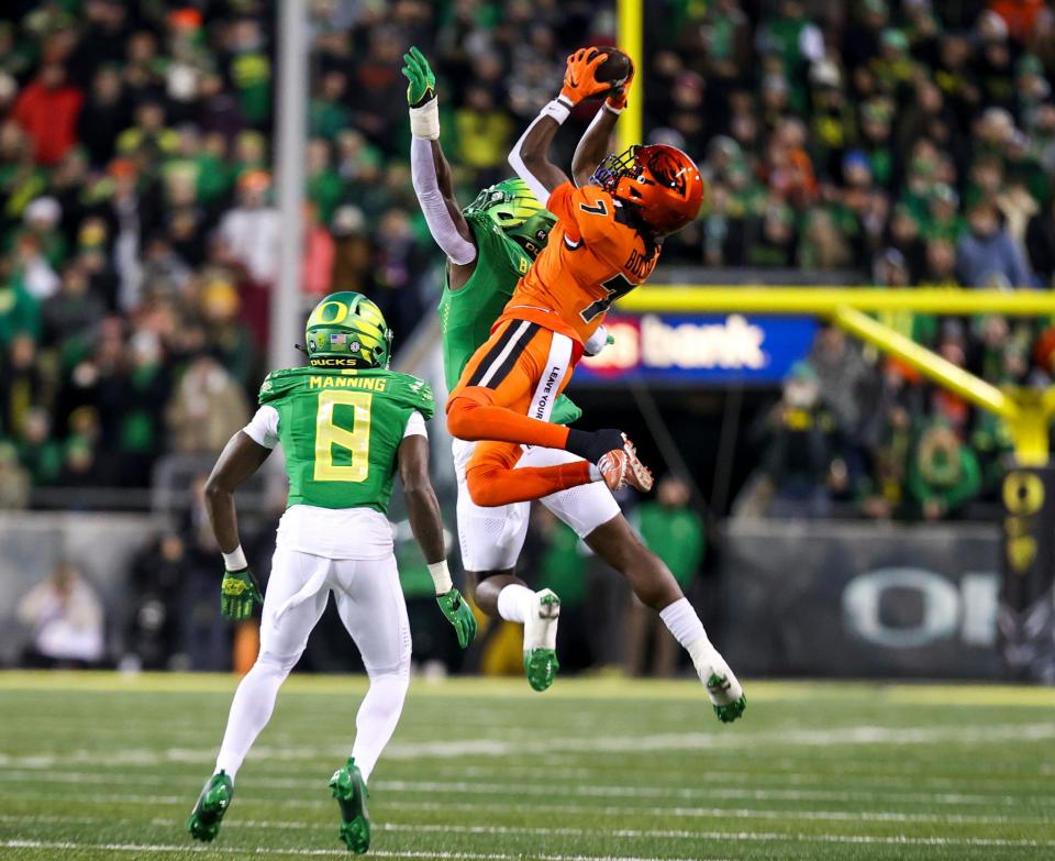 Oregon State wide receiver Silas Bolden goes high to grab a pass against Oregon defenders during their 2023 game at Autzen Stadium in Eugene, Ore. "Silas has an unbelievable work ethic," Texas head coach Steve Sarkisian said. "Football matters to him."