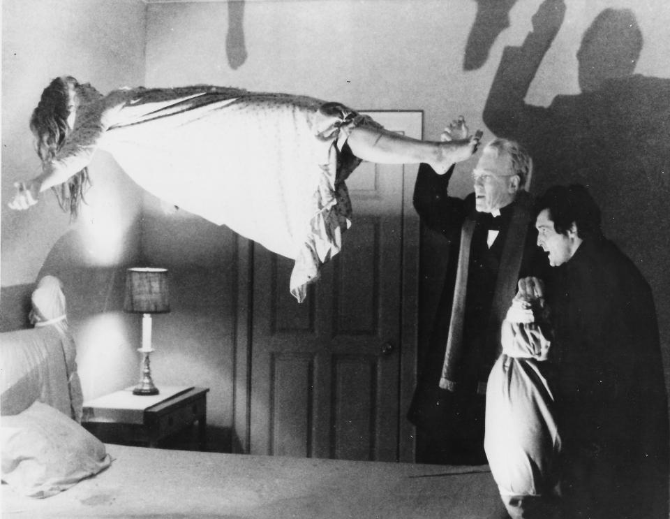 Two priests (Max von Sydow and Jason Miller) battle a demon who possesses the body of a young girl (Linda Blair) in the 1973 horror film “The Exorcist.”