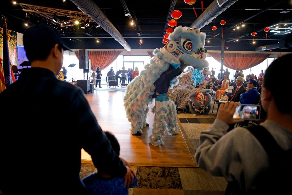 People watch as GQ Lion Dance from the Giac Quang Temple perform during a Tet, or Vietnamese New Year, celebration hosted by the Vietnamese American Community of Oklahoma at the Dove Event Center in Oklahoma City, Saturday, Jan. 14, 2023.