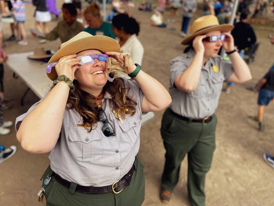 Park rangers use solar lenses to safely watch 2023's annular eclipse at San Antonio Missions National Historical Park in Texas.