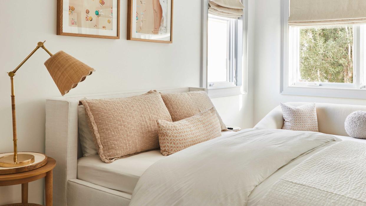  A bedroom painted in white . 