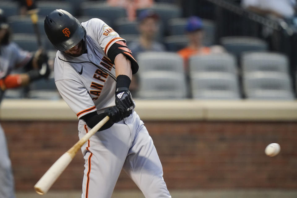 San Francisco Giants' Kris Bryant hits a two-run home run during the first inning of the team's baseball game against the New York Mets on Thursday, Aug. 26, 2021, in New York. (AP Photo/Frank Franklin II)