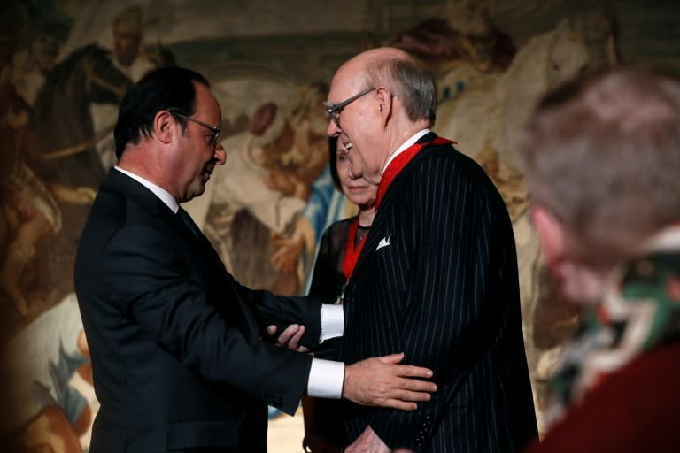 American collectors Marlene (C) and Spencer (R) Hays are awarded Commandeur de la Legion d'Honneur by French President Francois Hollande