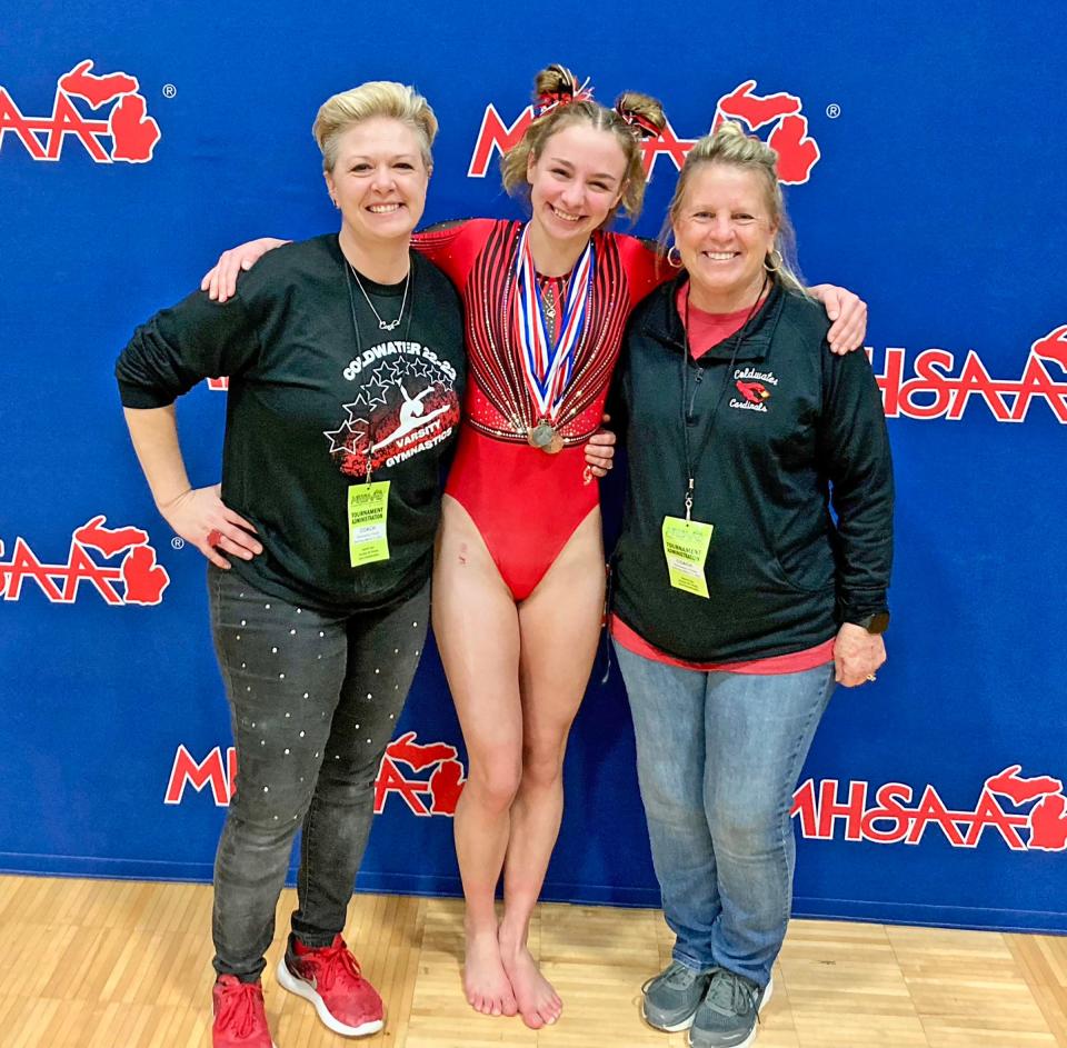 The Coldwater coaching duo of Kim Nichols (far left) and Janet Kahler (far right), joined here by All State gymnast Charlotte Calhoun, announced their retirement from Cardinal Gymnastics and now look to pass the torch to the next generation
