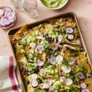 <p>Throw together some veggies, black beans, and shredded chicken on top of tortilla chips for an extremely easy weeknight dinner that's sure to be a hit for the whole family.</p><p><em><a href="https://www.womansday.com/food-recipes/food-drinks/a27497185/sheet-pan-chicken-nachos-recipe/" rel="nofollow noopener" target="_blank" data-ylk="slk:Get the Sheet Pan Chicken Nachos recipe.;elm:context_link;itc:0;sec:content-canvas" class="link ">Get the Sheet Pan Chicken Nachos recipe.</a></em></p>