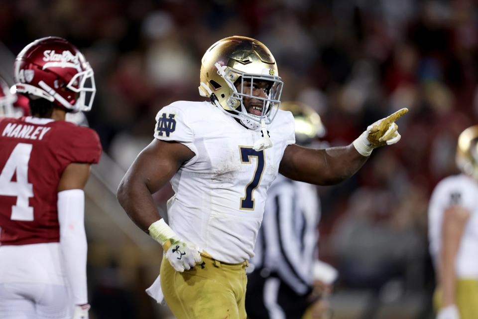 Notre Dame running back Audric Estime (7) is among the nation's leaders in rushing yards (1,341) and touchdowns (18). (AP Photo/Jed Jacobsohn)