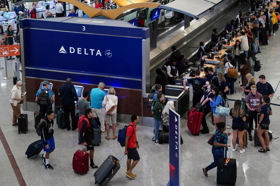 Passengers are seen at the Delta Air Lines check in area before their flights at Hartsfield-Jackson Atlanta International Airport in Atlanta, Georgia, U.S. June 28, 2022. REUTERS/Elijah Nouvelage